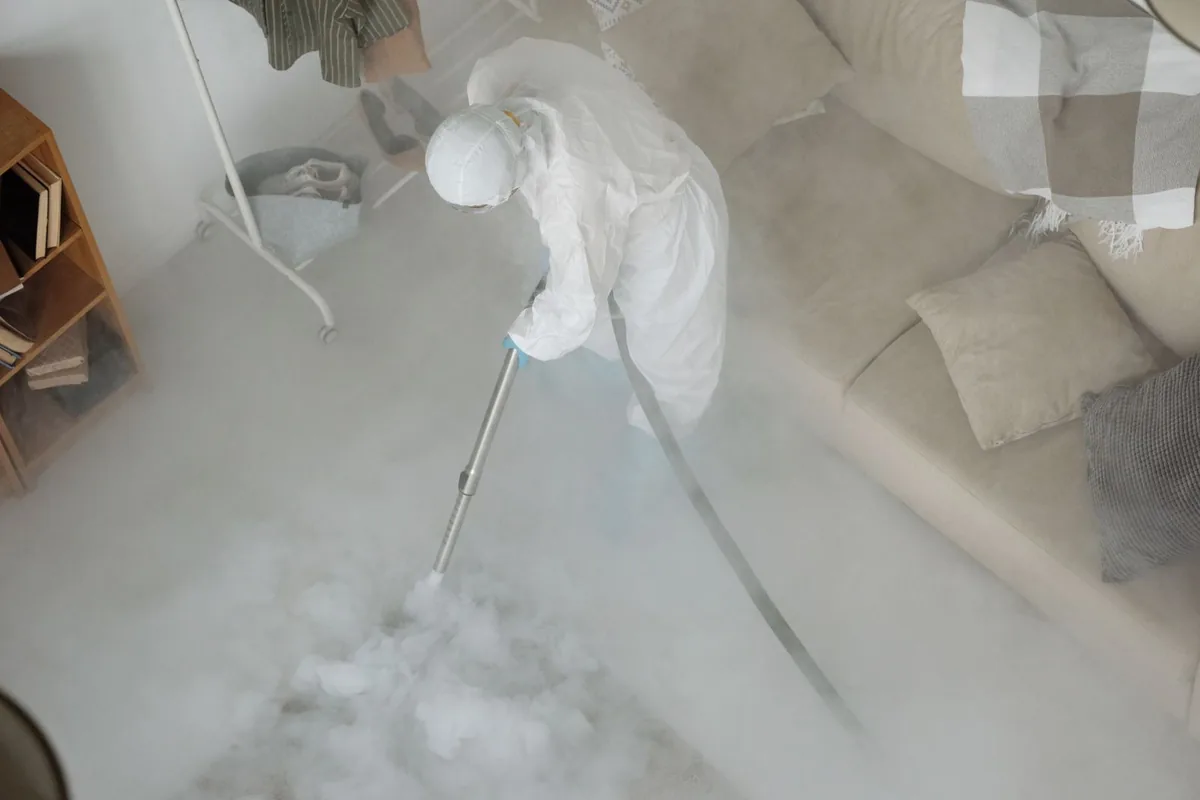 Biohazard cleanup technician in protective equipment, Alexandria, KY